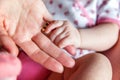 Little baby holding mother`s hand Royalty Free Stock Photo