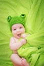 Baby in frog hat Royalty Free Stock Photo