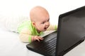 Little baby with laptop. Royalty Free Stock Photo