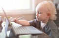 Little baby learning to use laptop computer . Royalty Free Stock Photo