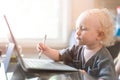 Little baby learning to use laptop computer . Royalty Free Stock Photo