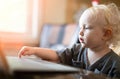 Little baby learning to use laptop computer . Royalty Free Stock Photo