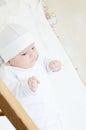 Little baby lying in crib Royalty Free Stock Photo