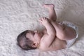 Little baby lying on white fluffy sheet Royalty Free Stock Photo