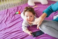 Little baby with a phone. on the bed. knowledge of mobile devices. Little baby with mobile phone. Little baby in casual colorful Royalty Free Stock Photo