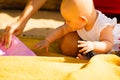 Little baby playing on beach during summertime Royalty Free Stock Photo