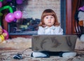 Little baby playing with laptop Royalty Free Stock Photo