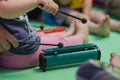 Little baby playing on the Resonator Bells with chopsticks Royalty Free Stock Photo