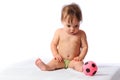 Little baby plays with small football ball Royalty Free Stock Photo