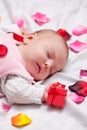 Little baby with rose petals Royalty Free Stock Photo