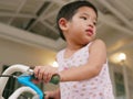 Little baby`s hands holding handlebars learning to ride a bicycle Royalty Free Stock Photo