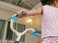 Little baby`s hands holding handlebars learning to ride a bicycle Royalty Free Stock Photo