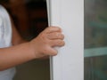 Little baby`s hands shutting / closing a sliding door