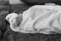 Little baby sleeping feet covered under blanket