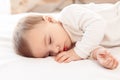 Little baby sleeping on bed at home close-up