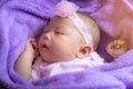 Little baby sleeping in purple crib Royalty Free Stock Photo