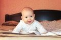 Little baby smiling on the bed