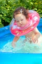 Little baby splashing in waterpool