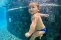 Little baby swimming and diving in pool with fun Royalty Free Stock Photo