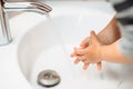Little baby toddler washing hands at home Royalty Free Stock Photo