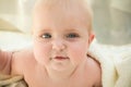 A little baby under a white towel Royalty Free Stock Photo