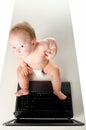 Little baby is working on laptop Royalty Free Stock Photo