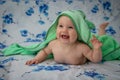 Little baby wrapped in a green towel Royalty Free Stock Photo