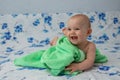 Little baby wrapped in a green towel Royalty Free Stock Photo