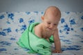 Little baby wrapped in a green towel Royalty Free Stock Photo