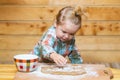 Little baker chef kid at kitchen. Happy baby child baking cookies. Royalty Free Stock Photo