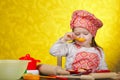 Little baker or cook girl cuts dough for cookies Royalty Free Stock Photo