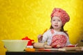 Little baker or cook girl cuts dough for cookies Royalty Free Stock Photo