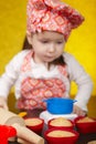 Little baker or cook girl cuts dough for cookies Royalty Free Stock Photo