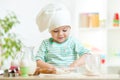 Little baker kid girl in chef hat Royalty Free Stock Photo