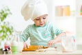 Little baker kid girl in chef hat Royalty Free Stock Photo