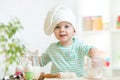 Little baker kid girl in chef hat Royalty Free Stock Photo