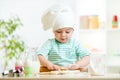 Little baker kid girl in chef hat Royalty Free Stock Photo