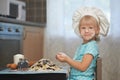 Little baker at work place Royalty Free Stock Photo