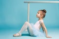 The little balerina dancer on blue background Royalty Free Stock Photo