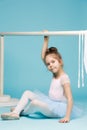 The little balerina dancer on blue background Royalty Free Stock Photo