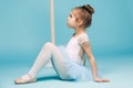 The little balerina dancer on blue background Royalty Free Stock Photo