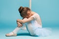 The little balerina dancer on blue background Royalty Free Stock Photo