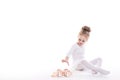 Little Ballerina and ballet shoes on a white background. Royalty Free Stock Photo