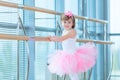 Little ballerina girl in a pink tutu. Adorable child dancing classical ballet in a white studio. Children dance. Kids Royalty Free Stock Photo