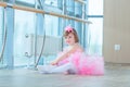 Little ballerina girl in a pink tutu. Adorable child dancing classical ballet in a white studio. Children dance. Kids Royalty Free Stock Photo