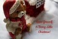 Little Bear figurine with Santa hat on puffy snow with a Holiday greeting.