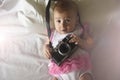 Baby girl with photo camera