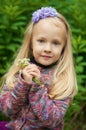 Little beautiful blond girl in nature