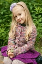 Little beautiful blond girl in nature