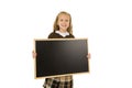Little beautiful blond schoolgirl smiling happy and cheerful holding and showing small blank blackboard